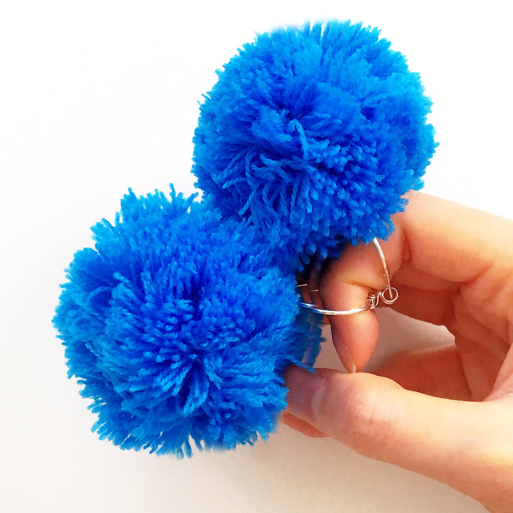 LARGE POM POM SMALL HOOP EARRINGS