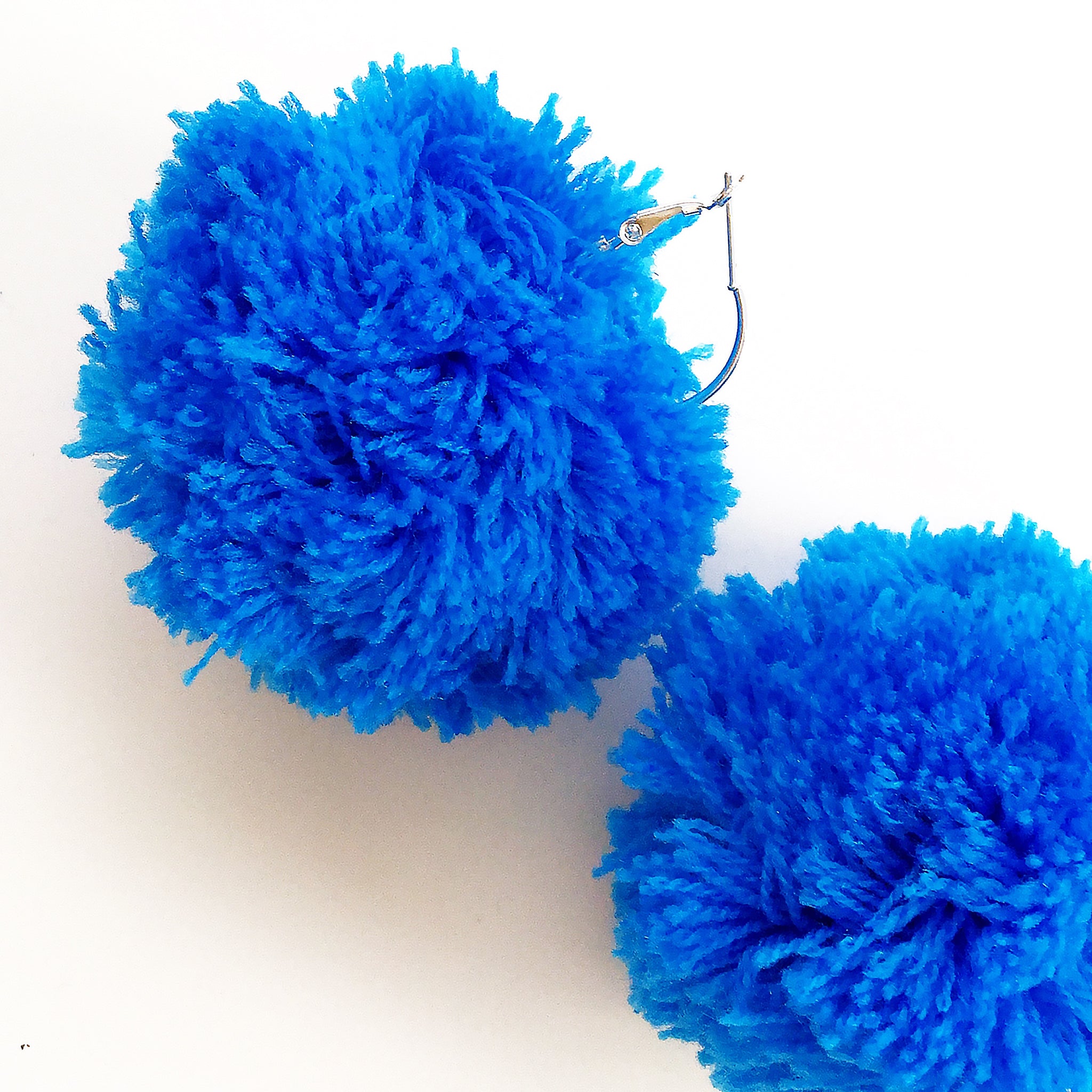 LARGE POM POM SMALL HOOP EARRINGS