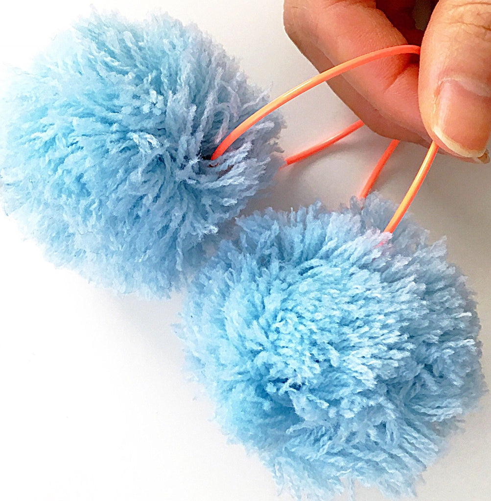 LARGE POM POM ORANGE HOOP EARRINGS